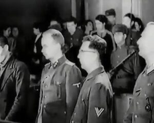Гитлеровцы и их пособник (первый слева) во время оглашения приговора. Харьков, 18 декабря 1943 года.