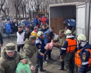 Оказывая помощь в борьбе с паводками.